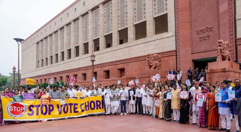 Protestors holding “Stop vote chori” banners during Bihar SIR protests outside Indian Parliament