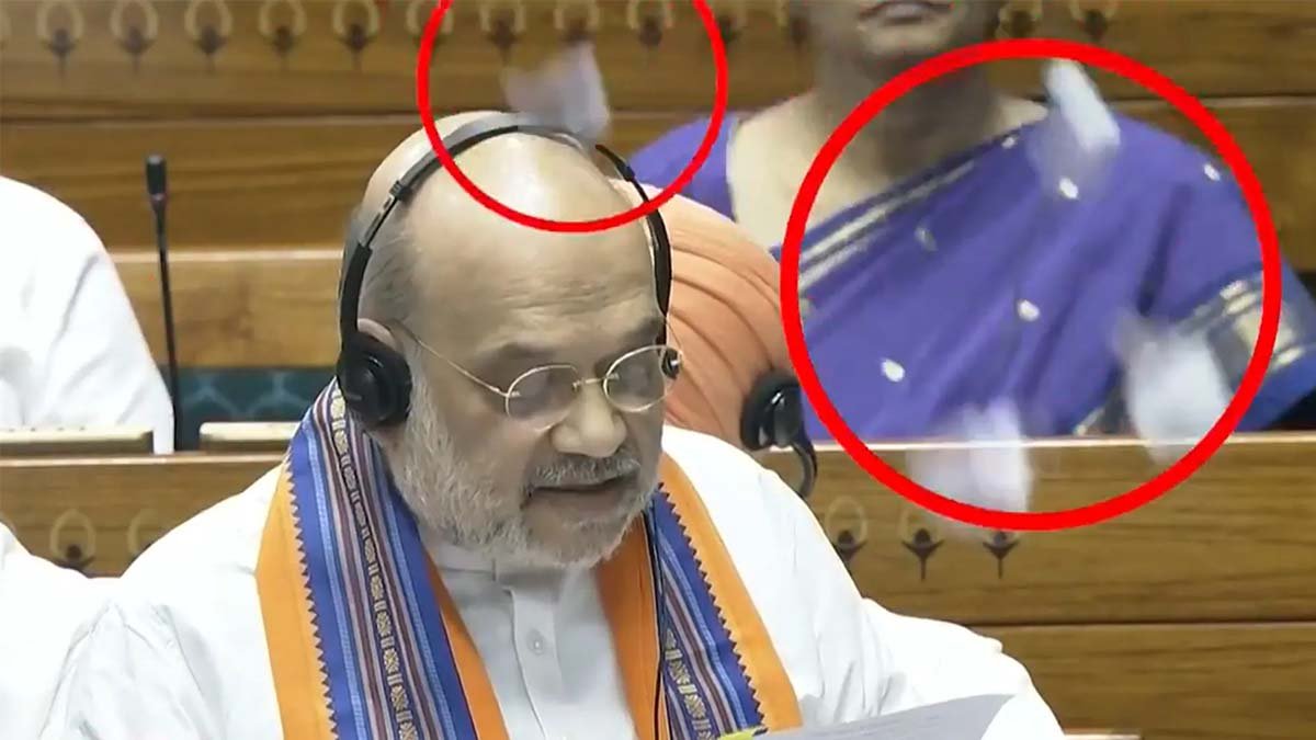 Opposition MPs throwing torn Bills at Amit Shah during Lok Sabha session.