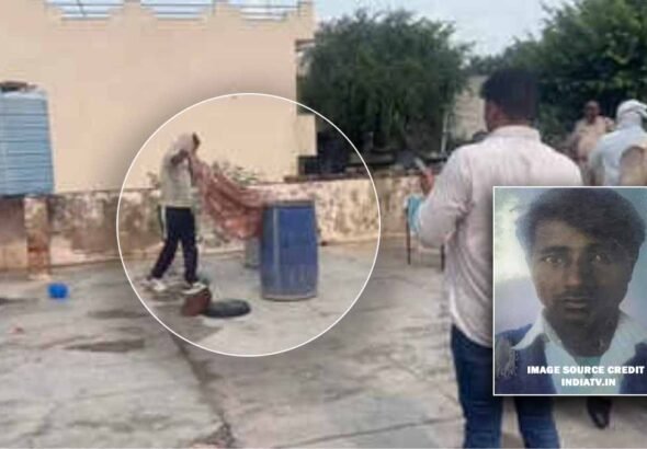Police officers working at the scene in Tijara where a blue drum containing a body was found.