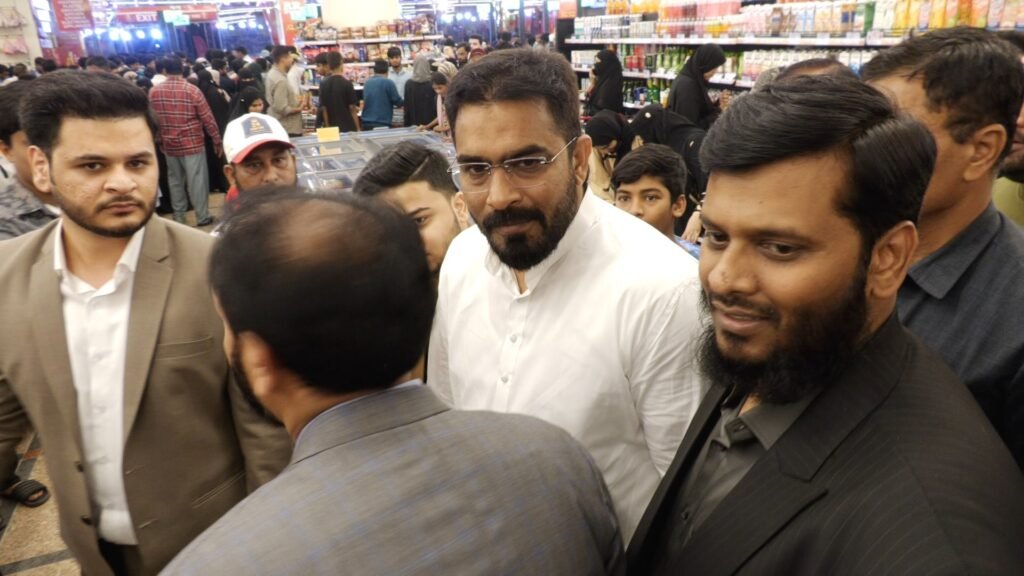 Crowd interaction scene at the Red Rose Mart Tolichowki inauguration event.