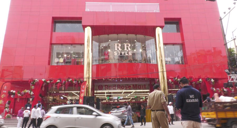Exterior view of the newly inaugurated Red Rose Mart Tolichowki building decorated for the launch event.