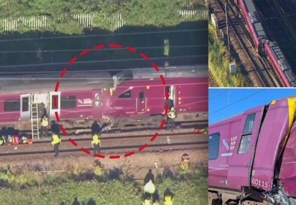 Emergency services at the scene after two passenger trains collided near Bedford, England.