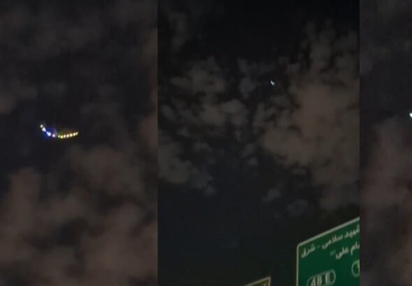 A mysterious object with bright lights seen hovering over Tehran at night.